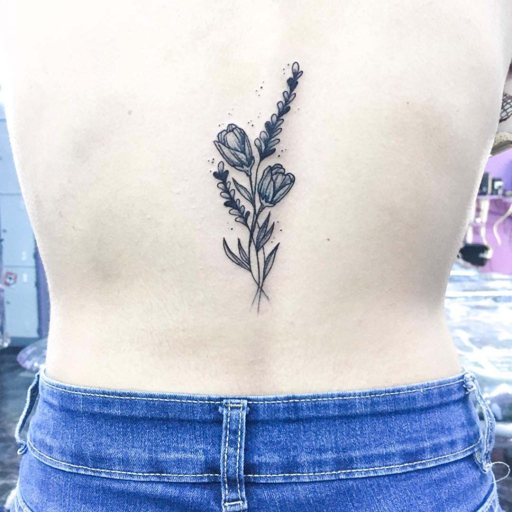 delicate flowers back tattoo