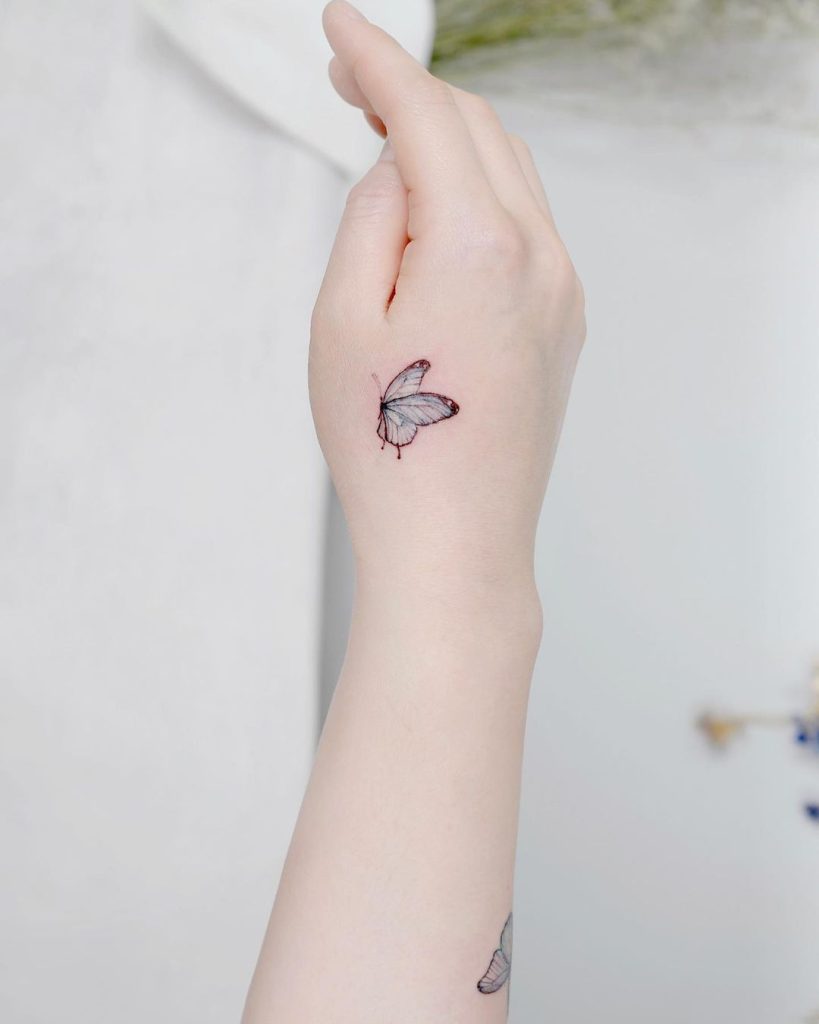 Small Butterfly Hand Tattoo