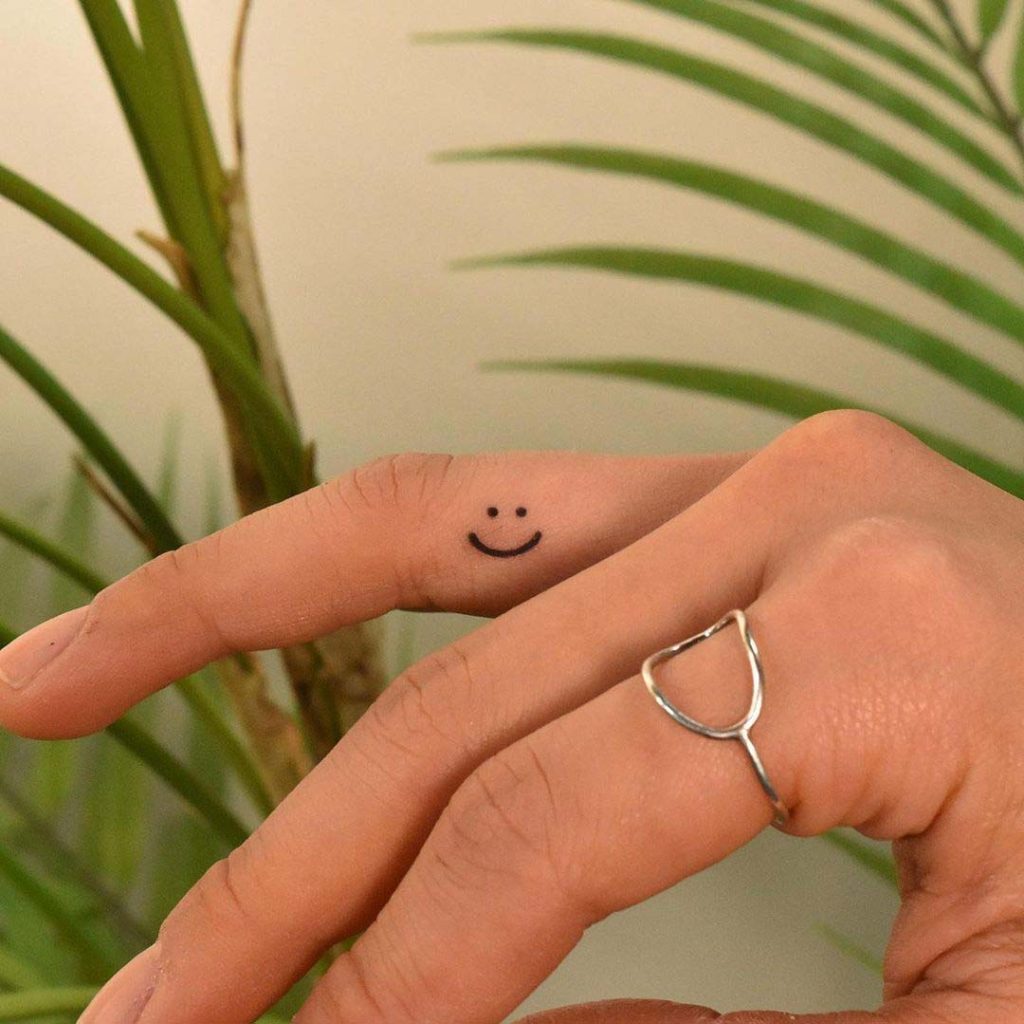  Smile Finger Tattoo